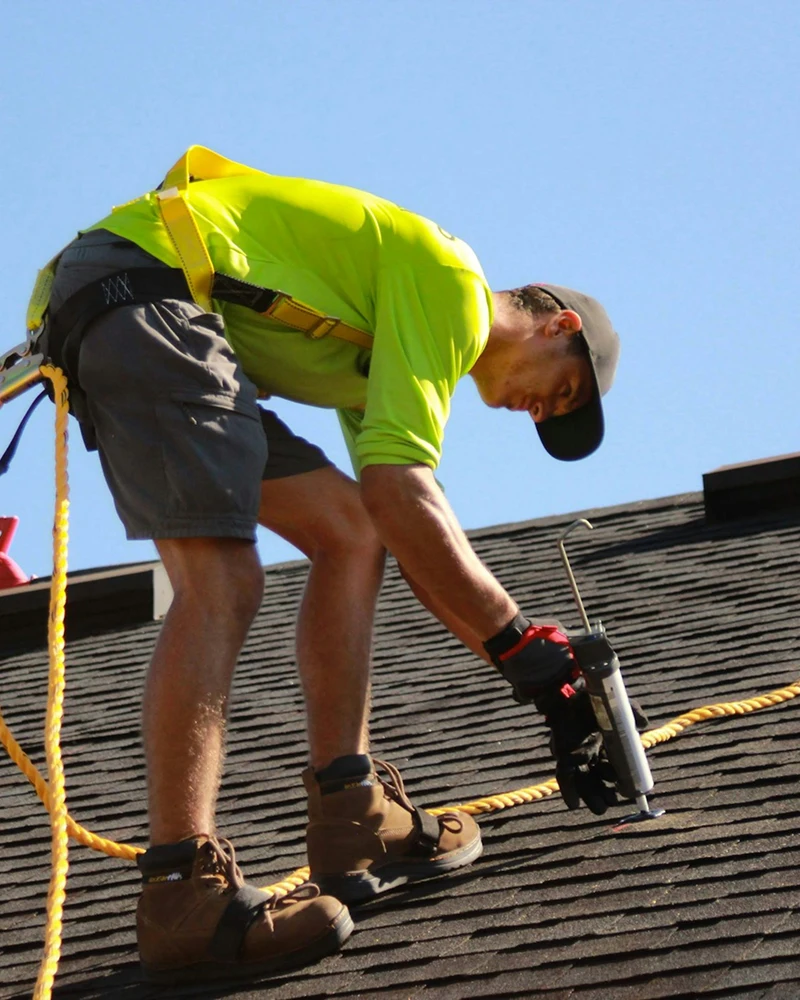 Window cleaning on a multi-storey building using a reach-and-wash pole